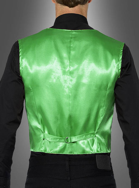 Eine Person ist von hinten zu sehen und trägt eine grüne Herrenweste mit Pailletten, wie sie typischerweise bei Karnevalskostümen verwendet wird, über einem schwarzen T-Shirt.