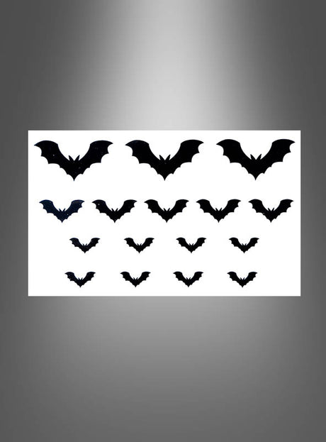 Diese „Tattoos Spinne oder Fledermaus“ (je 32 Stück) zeigen 32 Fledermaussilhouetten in verschiedenen Größen auf weißem Hintergrund, angeordnet in drei Reihen mit einem grauen Farbverlaufsrand, und eignen sich perfekt als Tattoo-Abziehbilder oder Hautaufkleber, um Ihrer Haut einen kreativen Touch zu verleihen.