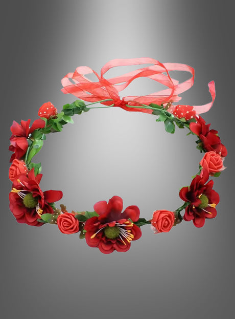 Ein Hippie- oder Elfen-Blumenkranz mit roten Kunstblumen, üppigem grünem Laub und einer bezaubernden roten Schleife wird vor einem grauen Farbverlaufshintergrund präsentiert – perfekt, um dein nächstes Hippie-Kostüm oder Elfen-Cosplay abzurunden.