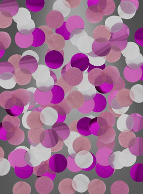 Blaue oder rosa *Tischkonfetti* (15 g) in Kreisform, verstreut auf einem grauen Hintergrund mit Farbverlauf, bilden die perfekte Tischdekoration (*Tischdeko*) für jede Mottoparty (*Mottoparty*).