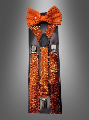 Pailletten-Hosenträger mit Fliege im Set in Orange, präsentiert auf einer schwarzen Karte vor einem grau verlaufenden Hintergrund – ein auffälliges Karnevals-Kostüm-Accessoire, das garantiert alle Blicke auf sich zieht.