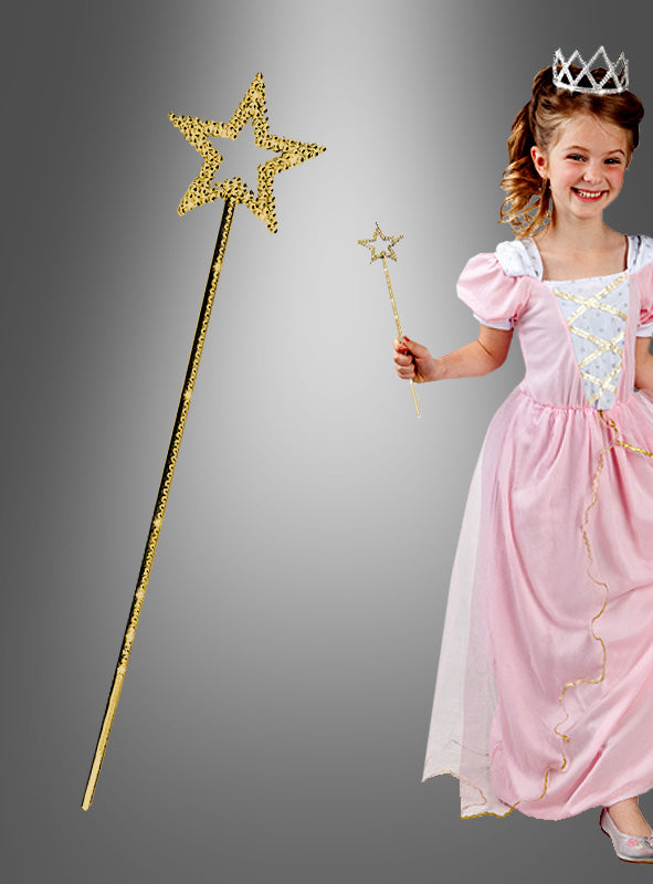 Ein Mädchen in einem rosa Prinzessinnenkleid und mit einer Tiara hält einen goldenen Zauberstab „Estelle Stern“ in der Hand; neben ihr ist auf einem grauen Hintergrund mit Farbverlauf eine Nahaufnahme des Zauberstabs „Estelle Stern“ für Kinder zu sehen, die dieses bezaubernde Kostümaccessoire besonders hervorhebt.