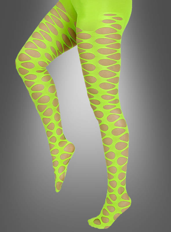 Eine Person, die die „Strumpfhose mit Lochmuster im 80er-Jahre-Stil“ in Neongrün mit großen ovalen Ausschnitten trägt, posiert mit einem angehobenen Bein vor einem schlichten grauen Hintergrund und verkörpert den kühnen Neon-Lochmuster-Look der 80er-Jahre-Mode.