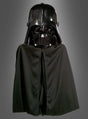 Eine Person, die den „Darth Vader Umhang mit Maske“ trägt, der der ikonischen Figur aus der „Star Wars“-Reihe sehr ähnlich sieht, steht vor einem schlichten grauen Hintergrund.