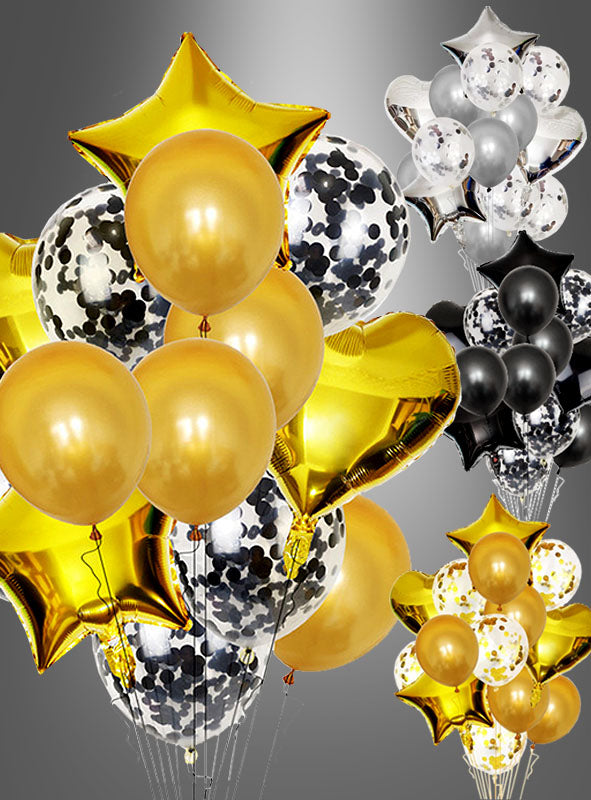 Glamour-Ballonstrauß in Gold, Silber oder Schwarz mit goldenen, schwarzen, silbernen und transparenten Konfetti-Luftballons sowie sternförmigen Folienballons, alles wunderschön vor einem grauen Hintergrund arrangiert.