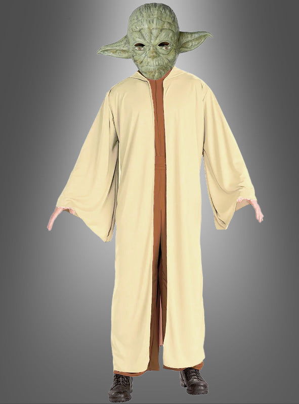 Eine Person, die das Original-Yoda-Kostüm für Herren aus STAR WARS trägt – bestehend aus einer grünen Yoda-Maske und einer beigen Robe –, vor einem schlichten grauen Hintergrund – ideal für alle Fans von Star-Wars-Kostümen oder Jedi-Ritter-Kostümen.