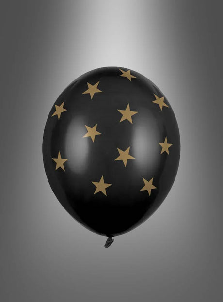 Ein „schwarzer Latexballon mit Sternen“ schwebt als edles Deko-Element vor einem schlichten grauen Farbverlaufshintergrund und ist mit gleichmäßig verteilten goldenen Sternen verziert.