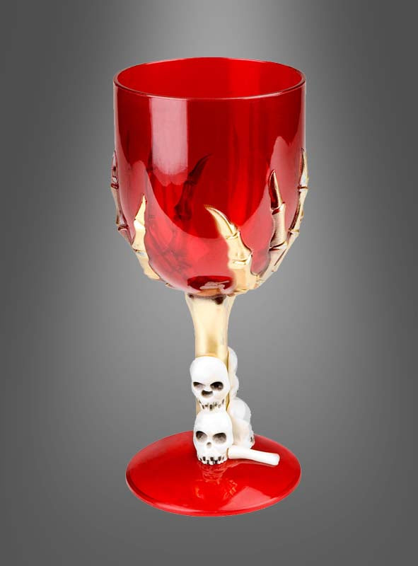 Wir präsentieren das Halloween-Weinglas mit Skeletthand (17 cm): ein leuchtend rotes Weinglas mit einem atemberaubenden goldenen Skeletthand-Motiv auf dem Kelch, ergänzt durch zarte weiße Totenkopf-Akzente entlang des Stiels. Vor einem grau verlaufenden Hintergrund setzt dieses einzigartige Stück ein unvergessliches Highlight für Ihre Halloween-Dekoration.