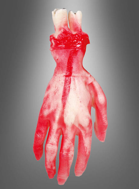 Die Halloween-Dekoration „Abgetrennte Hand“ ist ein realistisch aussehendes Gummibonbon in Form einer abgetrennten Hand in den Farben Rot und Weiß – perfekt als gruselige Halloween-Dekoration für jede Horrorparty – vor einem grauen Hintergrund mit Farbverlauf.