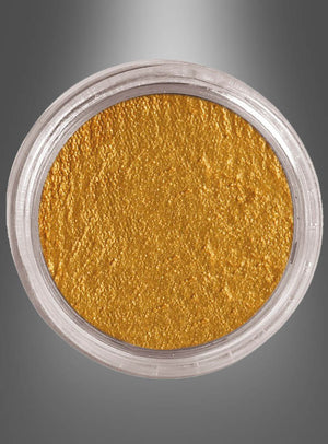 Ein durchsichtiger Kunststoffbehälter, gefüllt mit metallisch-goldenem Pigmentpulver „Aqua Makeup Gesichts- und Körperfarbe“, ideal zum Erzeugen atemberaubender Gesichts- oder Körperbemalungseffekte, von oben betrachtet vor einem grau verlaufenden Hintergrund.