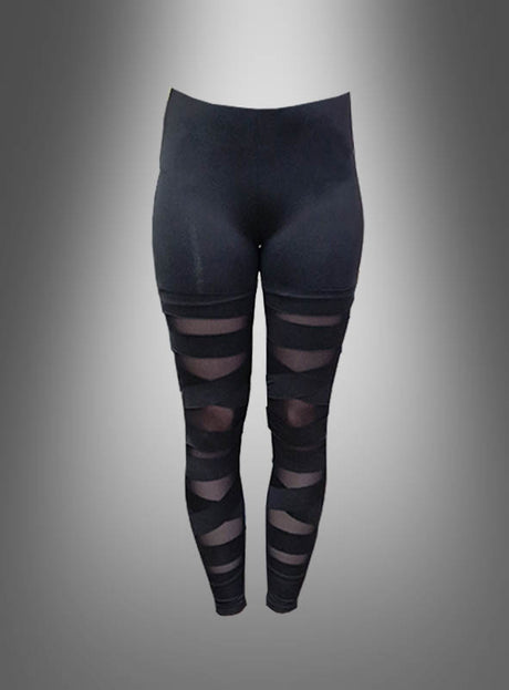 Die schwarzen „Deluxe Schlitz“-Leggings im 80er-Jahre-Stil mit hohem Bund zeichnen sich durch transparente Mesh-Streifen an den Oberschenkeln und Waden aus, inspiriert vom Bandagen-Look-Trend. Diese schwarzen Damen-Leggings zeichnen sich durch elegante, transparente Details aus und sorgen auf einem schlichten Farbverlaufshintergrund für einen modernen, stilvollen Auftritt.