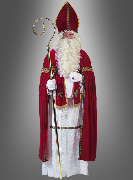 Gekleidet im Sankt-Nikolaus-Bischofskostüm – einer traditionellen Nikolaus-Tracht, bestehend aus einer rot-weißen Robe mit goldenen Verzierungen, einem hohen Hut, weißen Handschuhen und einem Stab – ist diese Figur perfekt für jede festliche Weihnachtsverkleidung gekleidet und hebt sich deutlich vom grauen Hintergrund ab.