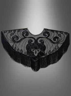 20er-Überwurf mit Fransen und Pailletten – ein schwarzer, halbkreisförmiger Schal mit kunstvoller Stickerei und glänzenden Pailletten, präsentiert vor einem grauen Farbverlauf. Dieses elegante Accessoire erinnert an ein Charleston-Kleid oder einen Überwurf aus den 20er Jahren und ist perfekt, um Ihr Flapper-Kostüm zu vervollständigen.