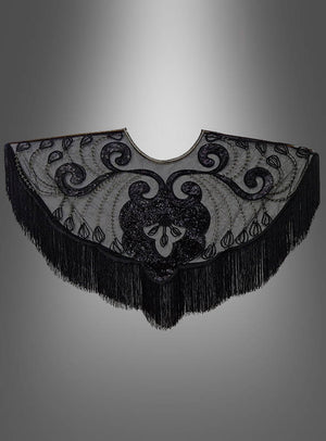 20er-Überwurf mit Fransen und Pailletten – ein schwarzer, halbkreisförmiger Schal mit kunstvoller Stickerei und glänzenden Pailletten, präsentiert vor einem grauen Farbverlauf. Dieses elegante Accessoire erinnert an ein Charleston-Kleid oder einen Überwurf aus den 20er Jahren und ist perfekt, um Ihr Flapper-Kostüm zu vervollständigen.