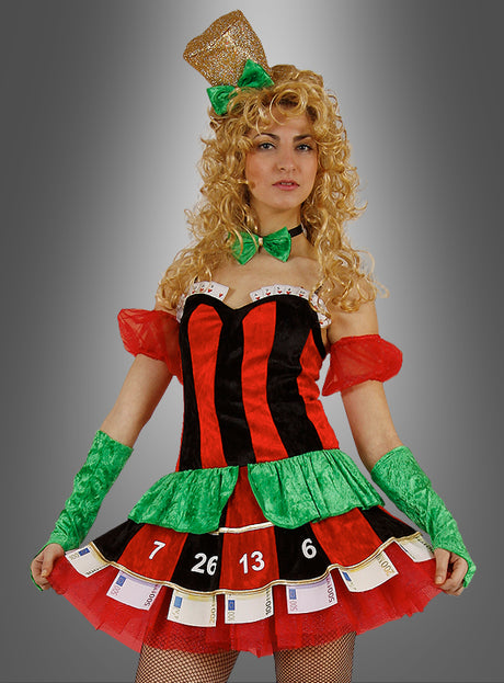 Eine Frau im „Casino-Kostüm Roulette für Damen“ – einem Outfit im Roulette-Stil in kräftigen Rot-, Schwarz- und Grüntönen, ergänzt durch eine Fliege, Handschuhe und einen Zylinder – steht vor einem grau verlaufenden Hintergrund; eine ideale Wahl für Fasching-Feiern oder glamouröse Las-Vegas-Partys.