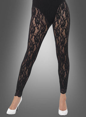 Eine Person, die schwarze „Romantische Spitzenleggings“ und weiße Stöckelschuhe trägt und vor einem grauen Hintergrund mit Farbverlauf steht – perfekt, um ein authentisches 80er-Jahre-Kostüm zu vervollständigen.