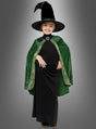 Ein Kind lächelt, während es das Professor-McGonagall-Kostüm für Kinder trägt – einen hohen schwarzen spitzen Hut, ein schwarzes Kleid und einen grünen Umhang – und vor einem schlichten grauen Hintergrund steht, wodurch es den Charakter dieses Harry-Potter-Kostüms perfekt einfängt.