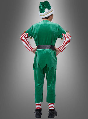 Eine Person steht mit den Händen in den Hüften da und trägt das „Grüner Weihnachtself“-Kinderkostüm mit rot-weiß gestreiften Ärmeln und Socken, einem schwarzen Gürtel und einer passenden Mütze; die Abbildung zeigt die Person von hinten vor einem grauen Hintergrund – ideal als Elfenkostüm für Jungen und Mädchen zu festlichen Anlässen.