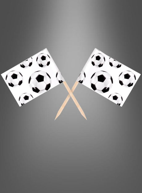 Zwei „Fußball-Partypicker mit Fahne“ (24 Stück) mit kleinen Papierfahnen mit Fußballmotiven an Holzstäbchen sind vor einem grau verlaufenden Hintergrund über Kreuz angeordnet.