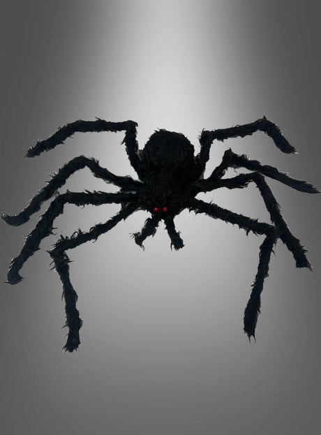 Riesige schwarze Spinne mit roten Augen und acht Beinen, präsentiert vor einem schlichten grauen Hintergrund – ideal als Halloween-Dekorationsrequisite „Spinne 30–90 cm“ oder als auffällige Ergänzung Ihrer Halloween-Deko-Spinnen-Sammlung.