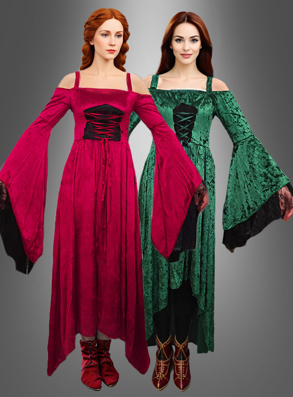 Zwei Frauen in Kleidern im mittelalterlichen Stil, eine in Rot und die andere in Grün, stehen nebeneinander vor einem grauen Hintergrund mit Farbverlauf. Beide tragen das Deluxe-Gewand „Gesine mit Spitze“ im Mittelalter-Stil, das sich durch lange, ausgestellte Ärmel und eine schwarze, korsettartige Taille auszeichnet und die Eleganz traditioneller mittelalterlicher Damenkleider widerspiegelt.