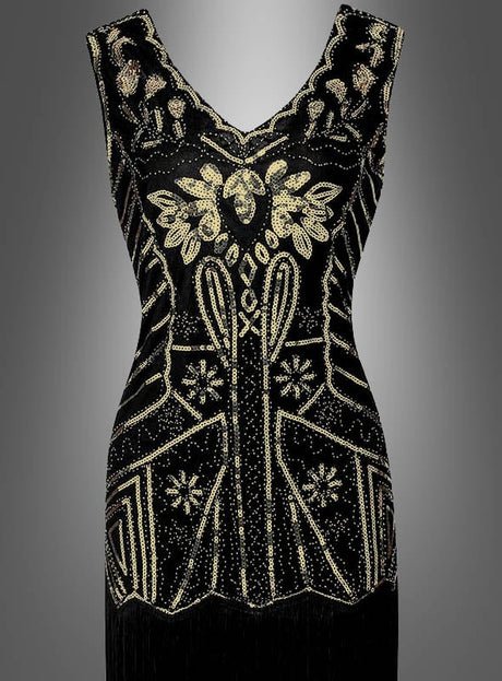 Ärmelloses schwarzes „Deluxe 20er“-Paillettenkleid „May“ mit aufwendig gearbeiteten geometrischen und floralen Mustern aus Goldperlen, V-Ausschnitt und figurbetonter Silhouette, präsentiert vor einem neutralen grauen Farbverlaufshintergrund – eine eindrucksvolle Hommage an die Mode der 20er Jahre und die Eleganz des Charleston-Kleids.