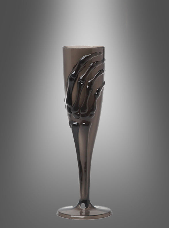 Verleihen Sie Ihrer nächsten Gothic-Party das gewisse Etwas mit dem „Skeletthand“-Sektglas (20 cm) – einem metallischen Sektglas, dessen Kelch von einer Skeletthand umschlungen wird, vor einem grauen Hintergrund mit Farbverlauf. Dank dieses einzigartigen Designs eignet es sich perfekt als einzigartige Halloween-Tischdekoration.