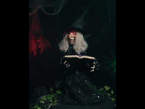 Animierte Hexe mit Zauberbuch 70cm Halloween