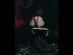 Animierte Hexe mit Zauberbuch 70cm Halloween